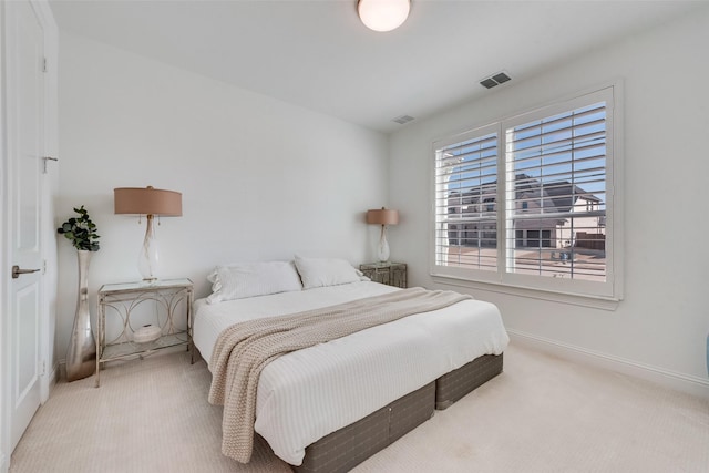 bedroom featuring baseboards, visible vents, and carpet floors