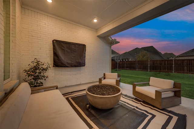 view of patio with an outdoor living space and a fenced backyard