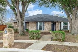 ranch-style home with fence