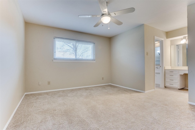 unfurnished bedroom featuring baseboards, light colored carpet, and a ceiling fan