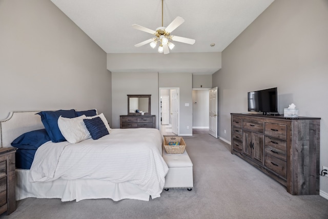 bedroom with light carpet, ceiling fan, and baseboards