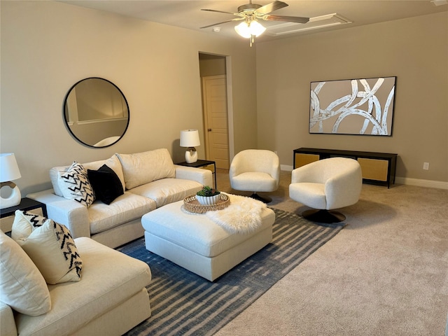 living room with baseboards, carpet, and ceiling fan