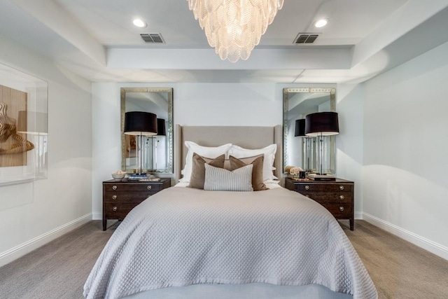 carpeted bedroom with visible vents, baseboards, a raised ceiling, and a notable chandelier