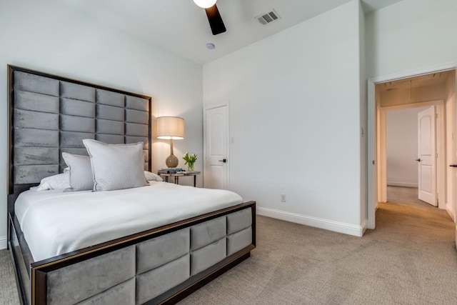 carpeted bedroom featuring baseboards, visible vents, and ceiling fan