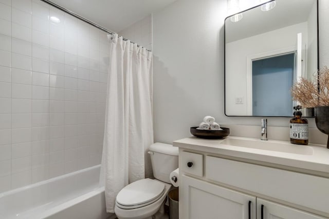 full bathroom with toilet, vanity, and shower / bath combo