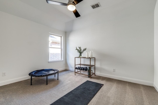 living area with visible vents, baseboards, a ceiling fan, and carpet floors