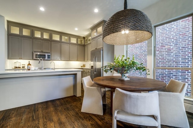 dining area with recessed lighting and dark wood-style flooring