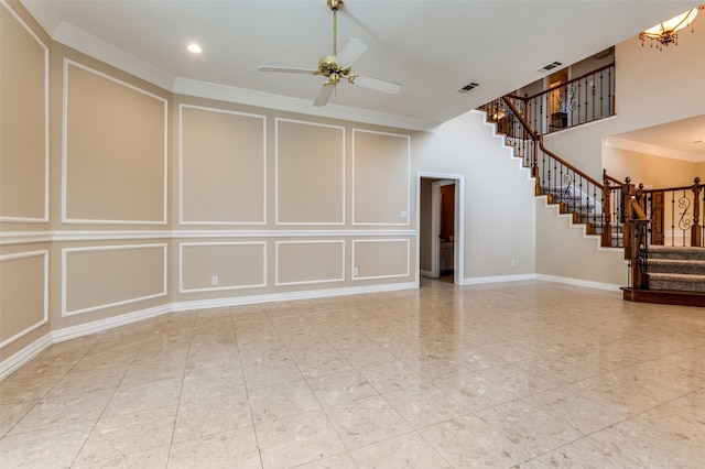 unfurnished living room featuring stairway, visible vents, ornamental molding, a decorative wall, and ceiling fan with notable chandelier