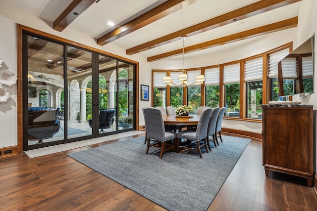 dining space with beam ceiling, a healthy amount of sunlight, and dark wood-style floors