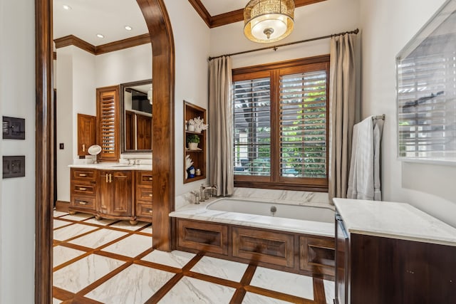 bathroom with a garden tub, ornamental molding, recessed lighting, baseboards, and vanity