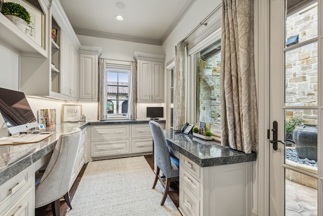 home office with recessed lighting, built in study area, and ornamental molding