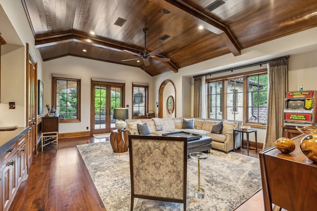 living room with dark wood-style floors, lofted ceiling, plenty of natural light, and wooden ceiling