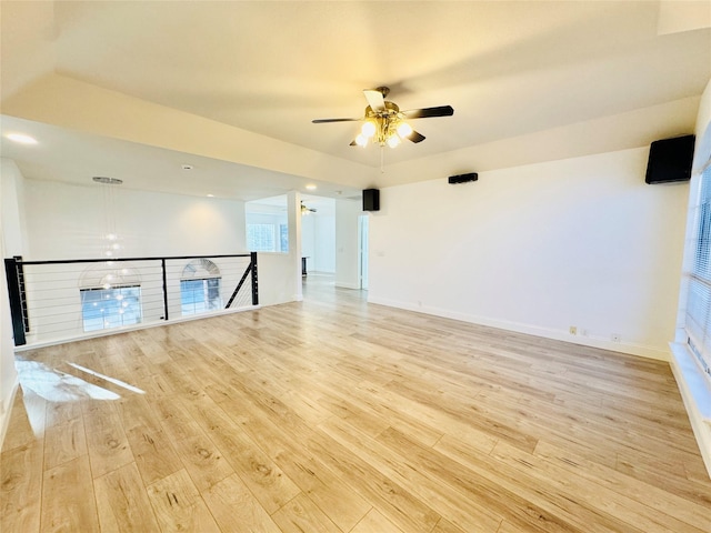 empty room featuring recessed lighting, light wood-style floors, baseboards, and ceiling fan