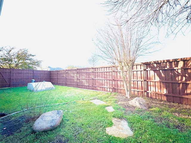 view of yard featuring a fenced backyard