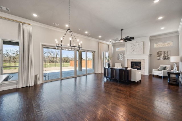 unfurnished living room featuring a tiled fireplace, visible vents, and dark wood finished floors