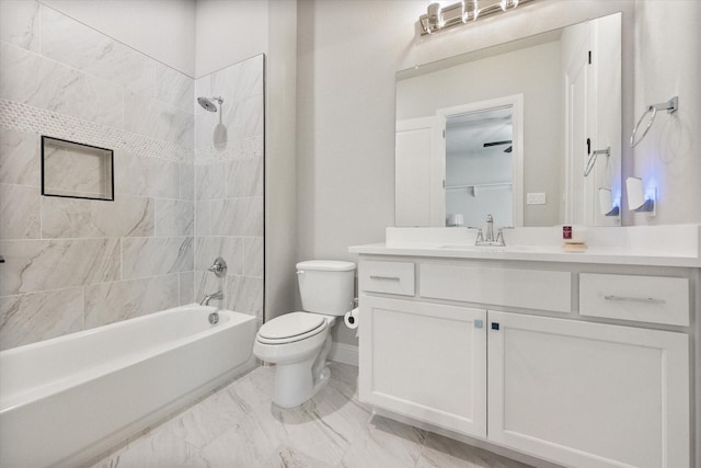 bathroom with vanity, baseboards, tub / shower combination, toilet, and marble finish floor