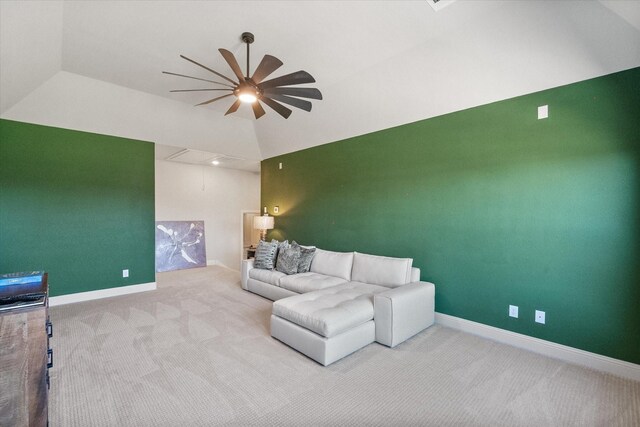 living area with baseboards, carpet floors, ceiling fan, and vaulted ceiling