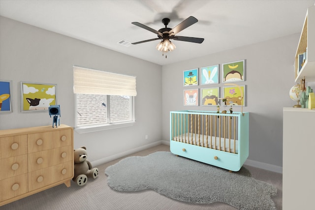 bedroom featuring baseboards, carpet floors, visible vents, and ceiling fan