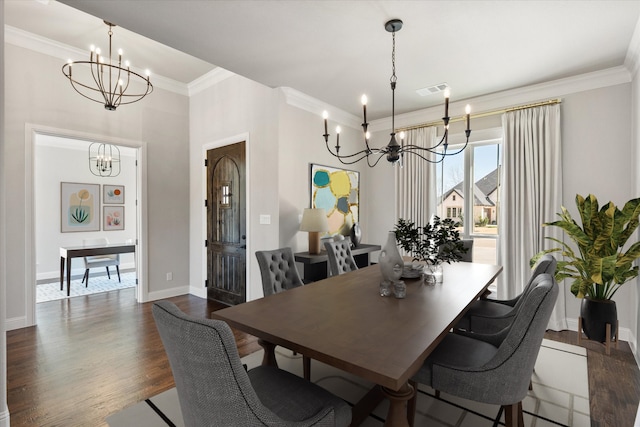 dining space with visible vents, dark wood-type flooring, baseboards, ornamental molding, and a notable chandelier