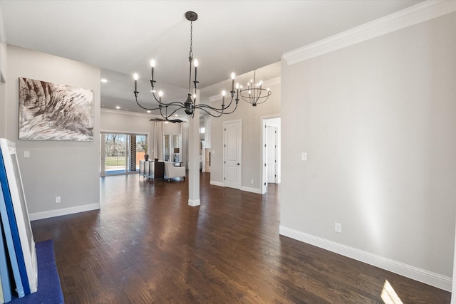 unfurnished dining area featuring baseboards, dark wood-type flooring, a notable chandelier, and crown molding