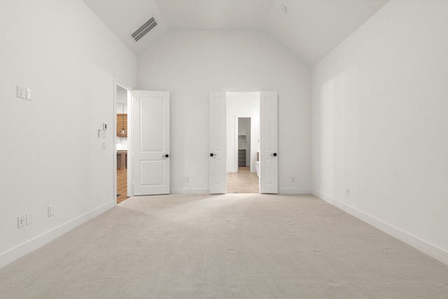 unfurnished bedroom featuring visible vents, light carpet, and baseboards