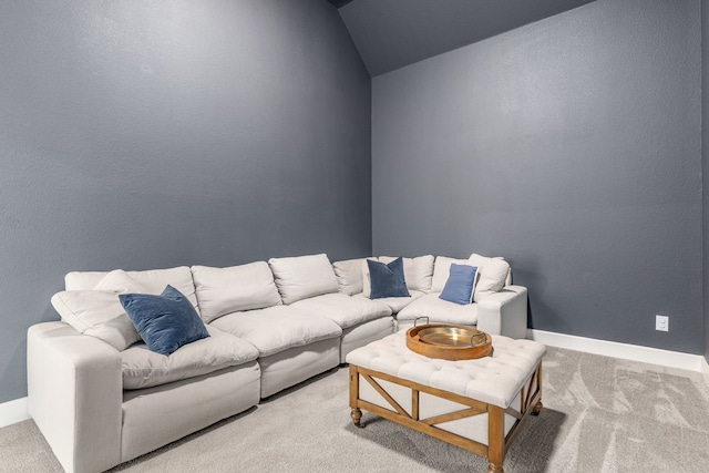 living room with lofted ceiling, carpet flooring, a textured wall, and baseboards