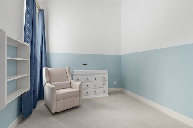 living area with baseboards and carpet floors