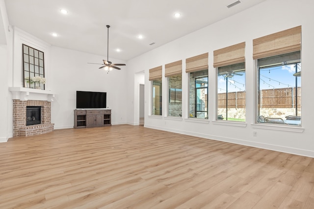 unfurnished living room featuring recessed lighting, visible vents, light wood-style flooring, and a fireplace