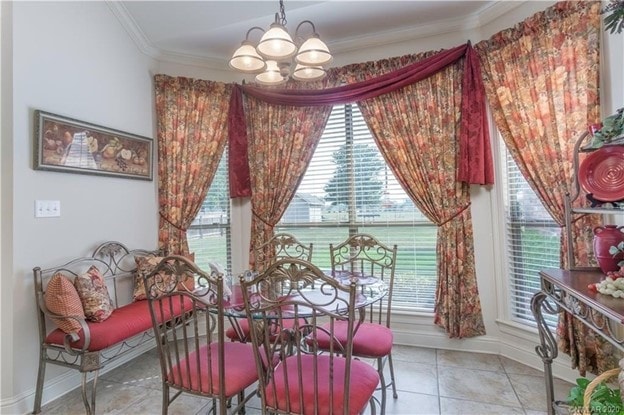 dining room with light tile patterned floors, baseboards, a chandelier, and ornamental molding