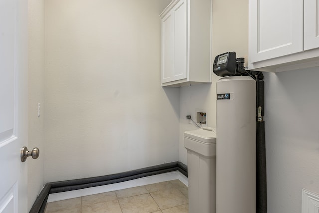 washroom featuring baseboards, washer hookup, light tile patterned floors, cabinet space, and hookup for an electric dryer