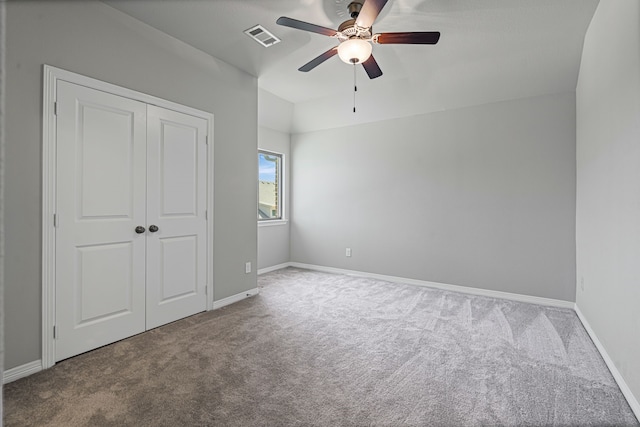 unfurnished bedroom featuring baseboards, visible vents, and carpet floors