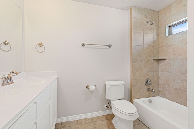 bathroom with tile patterned floors, toilet, baseboards, bathing tub / shower combination, and vanity