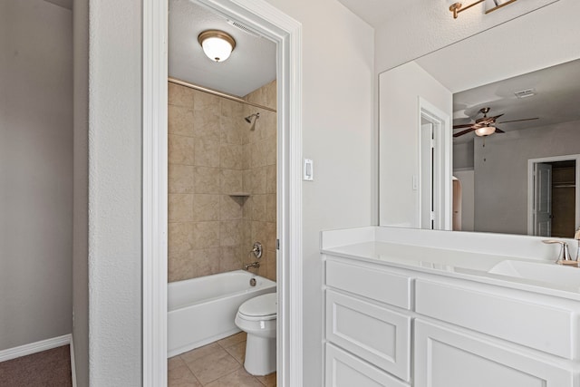 bathroom with a ceiling fan, baseboards, tile patterned flooring, shower / bath combination, and toilet