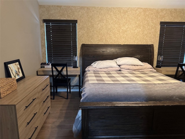 bedroom with dark wood finished floors