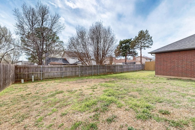 view of yard with a fenced backyard