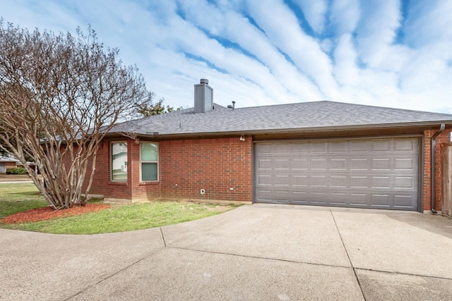 view of front of home featuring driveway, roof with shingles, an attached garage, brick siding, and a chimney