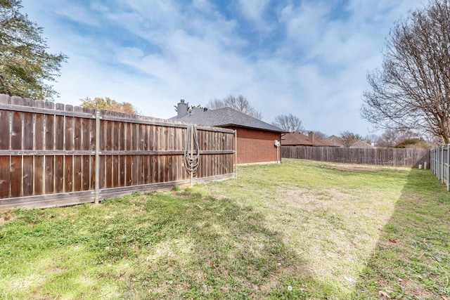 view of yard featuring a fenced backyard