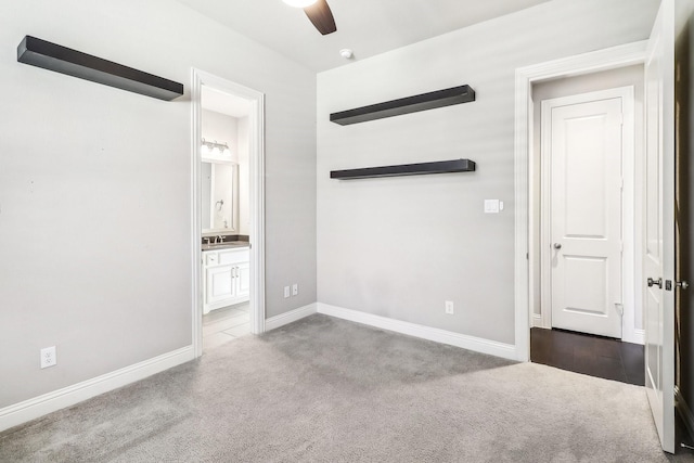 unfurnished room with baseboards, lofted ceiling, ceiling fan, and carpet floors