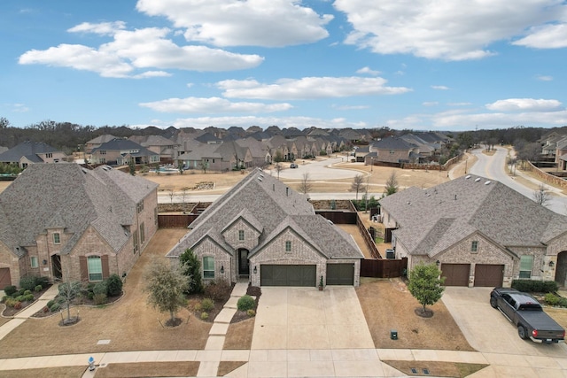 birds eye view of property with a residential view