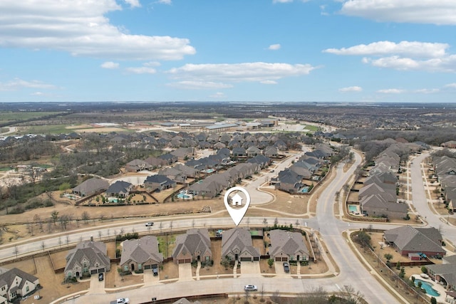 birds eye view of property with a residential view