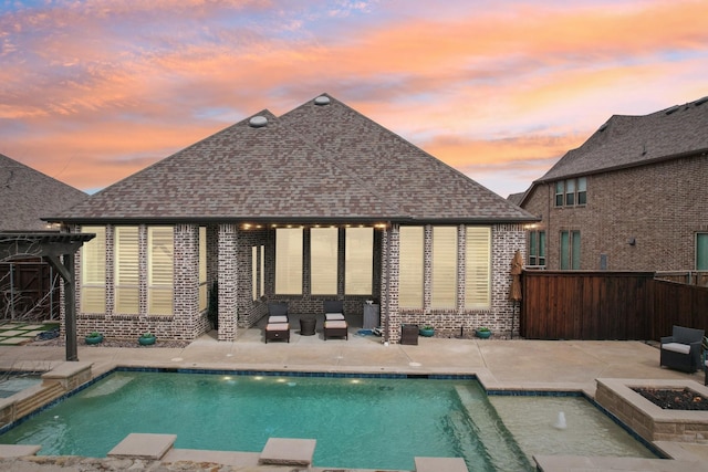 view of swimming pool featuring a gazebo, a fire pit, a fenced backyard, and a patio area