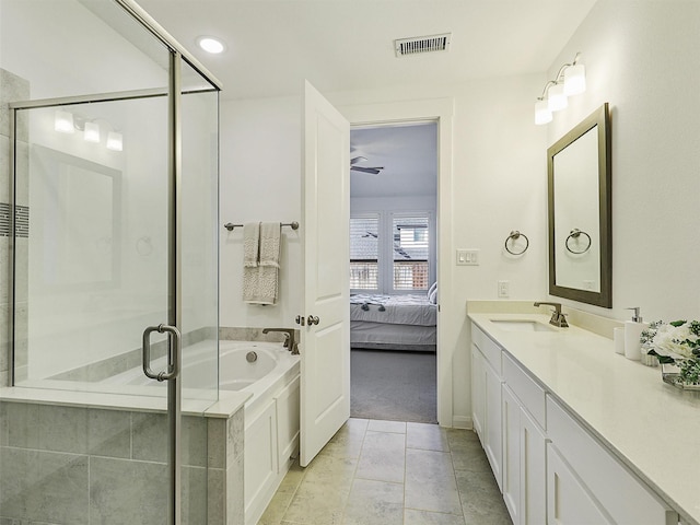 bathroom featuring vanity, a garden tub, visible vents, and a stall shower