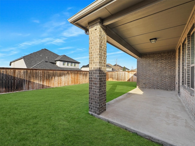 view of yard featuring a patio area and a fenced backyard