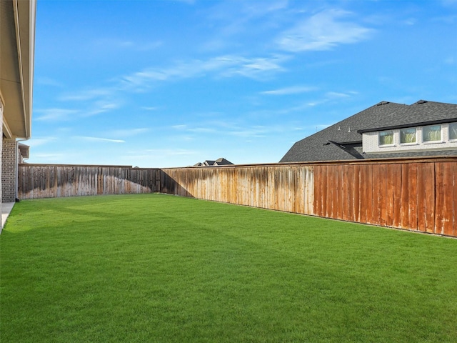 view of yard featuring a fenced backyard