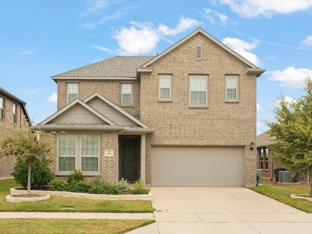 view of front facade with brick siding, cooling unit, driveway, and a garage