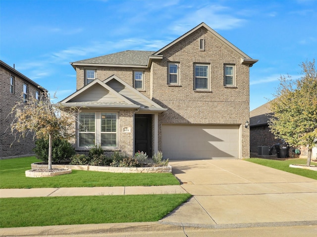 traditional-style house with a front lawn, driveway, roof with shingles, an attached garage, and brick siding