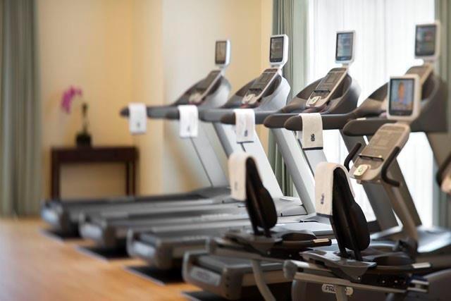 exercise room with wood finished floors