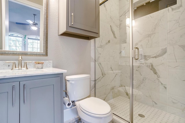 full bath featuring toilet, a stall shower, a ceiling fan, vanity, and a textured wall