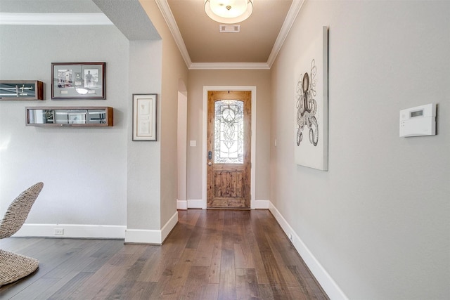 entryway with visible vents, crown molding, baseboards, and hardwood / wood-style flooring