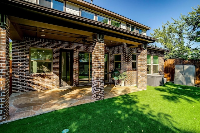 view of patio featuring ceiling fan and fence